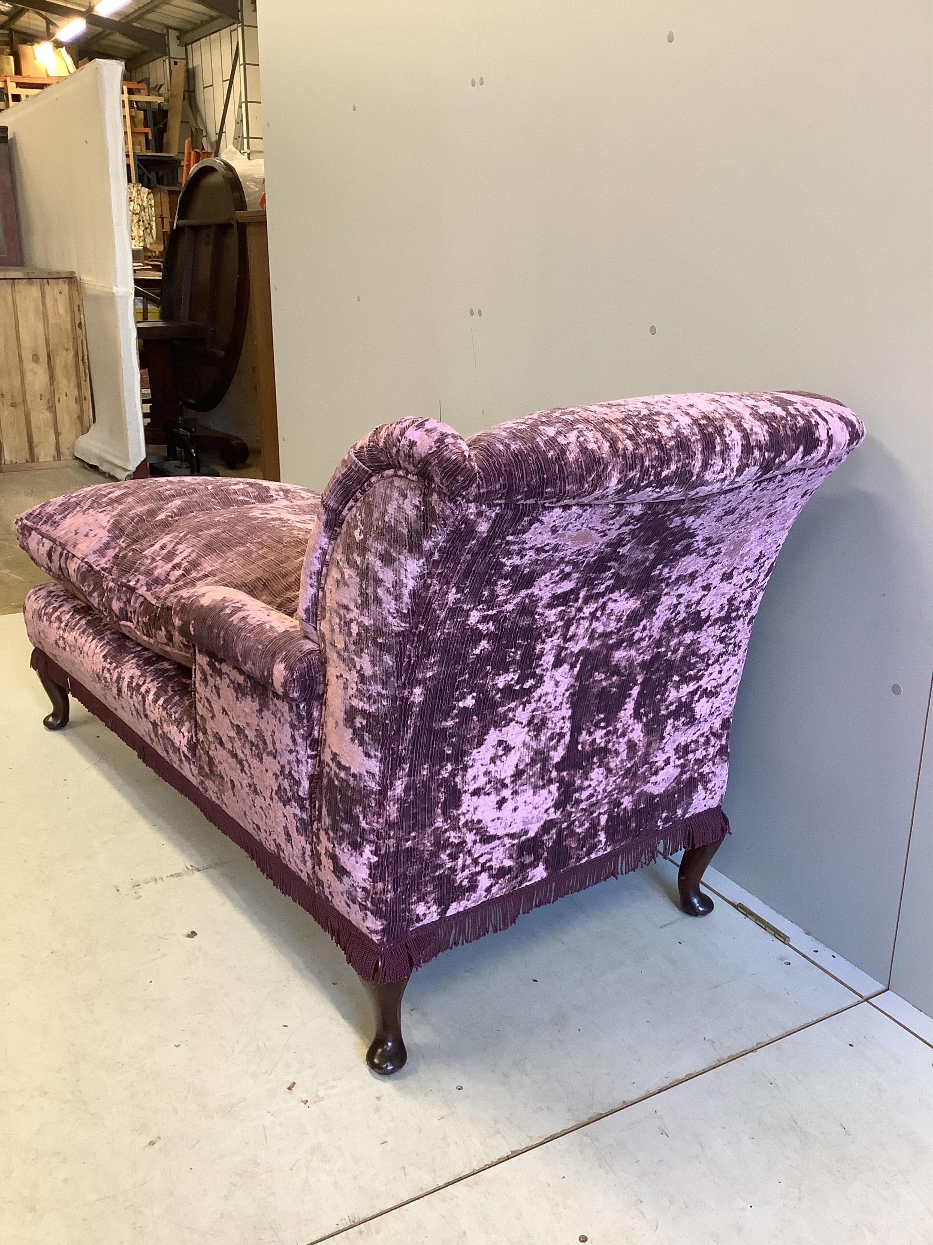 An early 20th century day bed, re-upholstered in contemporary buttoned purple fabric, width 160cm, depth 67cm, height 84cm. Condition - good